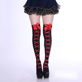 Black thigh-high stockings with red crossed bones and matching red bows, shown against a white background.