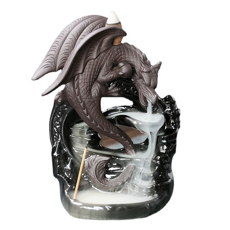 Dragon backflow incense burner isolated against white, with a gray curled dragon above the glossy black base and descending smoke channels.