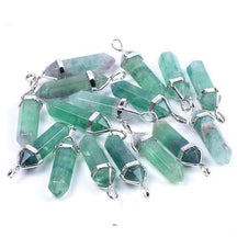 Green-led fluorite point pendants grouped on white, showing natural colour variation beneath silver-tone caps.