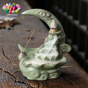 Green crescent moon incense burner with pale green scroll details and a descending smoke effect, beside a graphic of the included 20 cones.