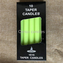 Green slender ritual candles displayed with a box, showing the rich green colour and straight sides.
