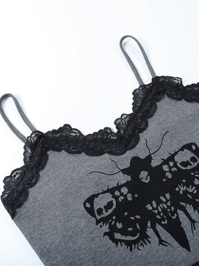 Close view of the grey tank neckline and black moth artwork. Thin straps rise above the scalloped lace trim.