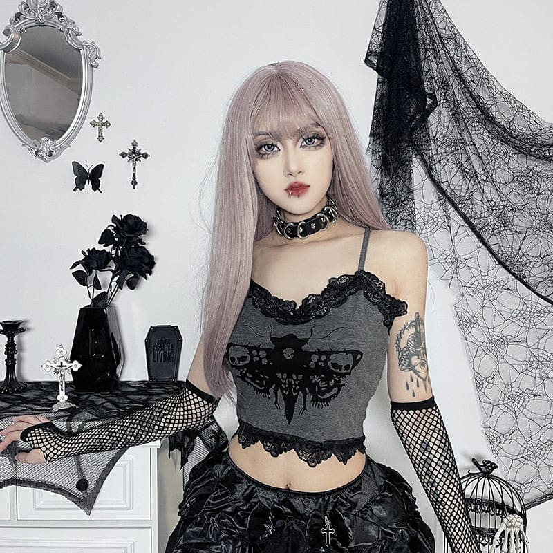 Grey moth-print cropped tank styled with fishnet arm warmers as the model holds both arms out. The thin straps and black lace edges remain visible.