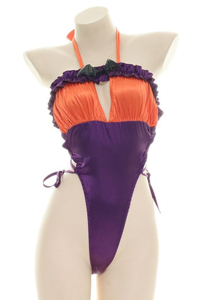 Orange and purple Halloween bodysuit with ruffled trim, a bat neckline accent, halter ties, and lace-up sides