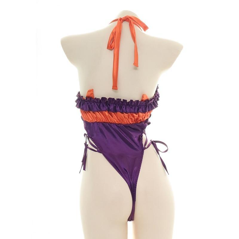 Orange and purple Halloween bodysuit with ruffled trim, a bat neckline accent, halter ties, and lace-up sides