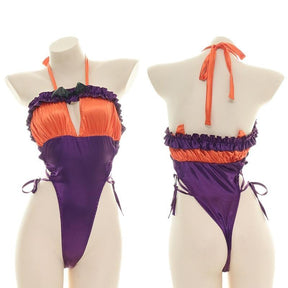 Orange and purple Halloween bodysuit with ruffled trim, a bat neckline accent, halter ties, and lace-up sides