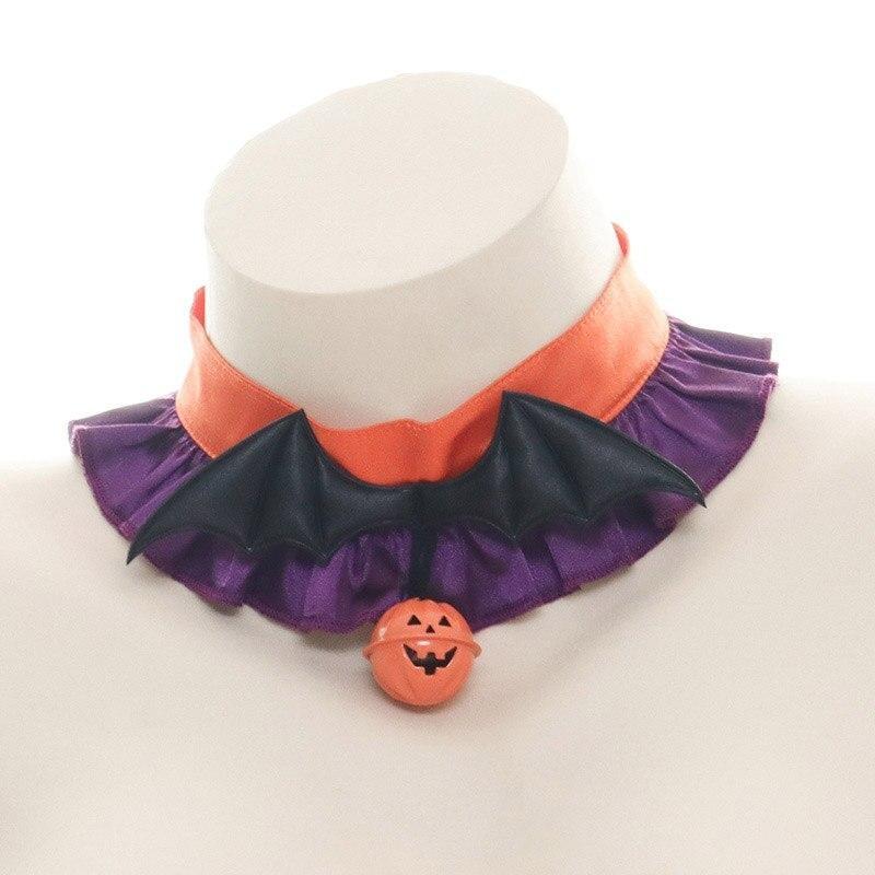 Orange and purple ruffled Halloween choker on a white display bust, with black bat wings and an orange jack-o-lantern charm at the center.