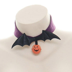 Purple Bat Wings choker on a white display bust, showing the plain purple band, black wing centerpiece and hanging jack-o-lantern charm.