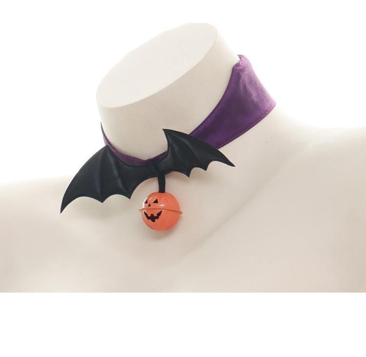 Angled view of the purple bat-wing pumpkin choker on a white bust, showing the smooth purple band behind the raised black wings.