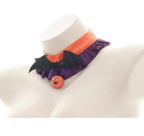Side angle of the Orange Purple Ruffles choker, showing the orange band above purple ruffles and the black bat-wing centerpiece.