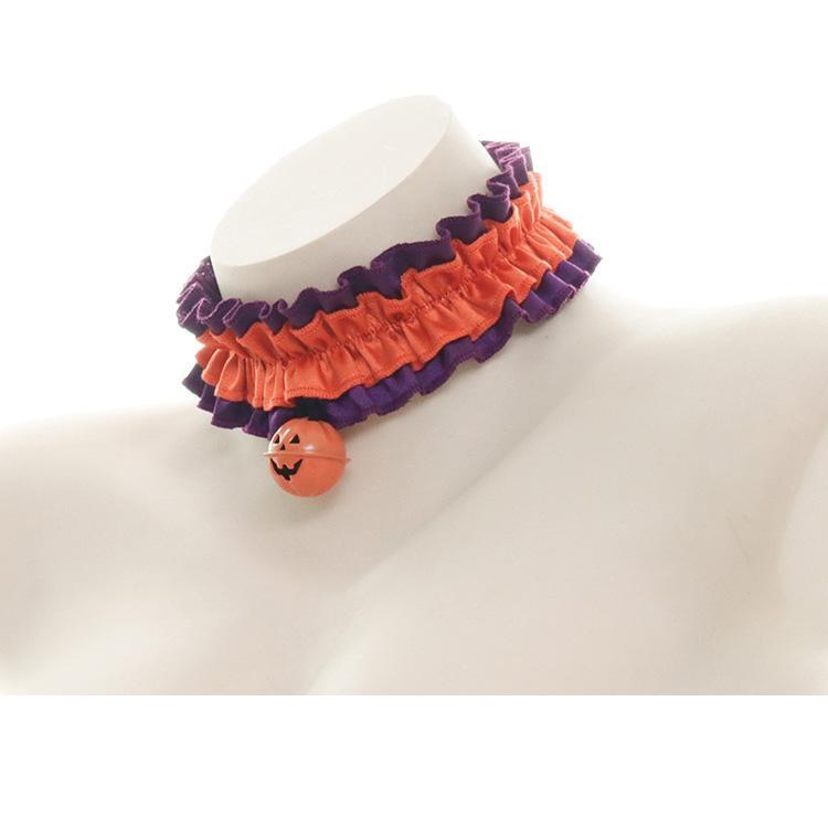 Orange ruffled pumpkin choker viewed from an angle on a white bust, showing the gathered band and narrow purple trim.