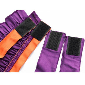 Back fastening detail of the Halloween chokers, showing black hook-and-loop patches on the orange and purple fabric bands.