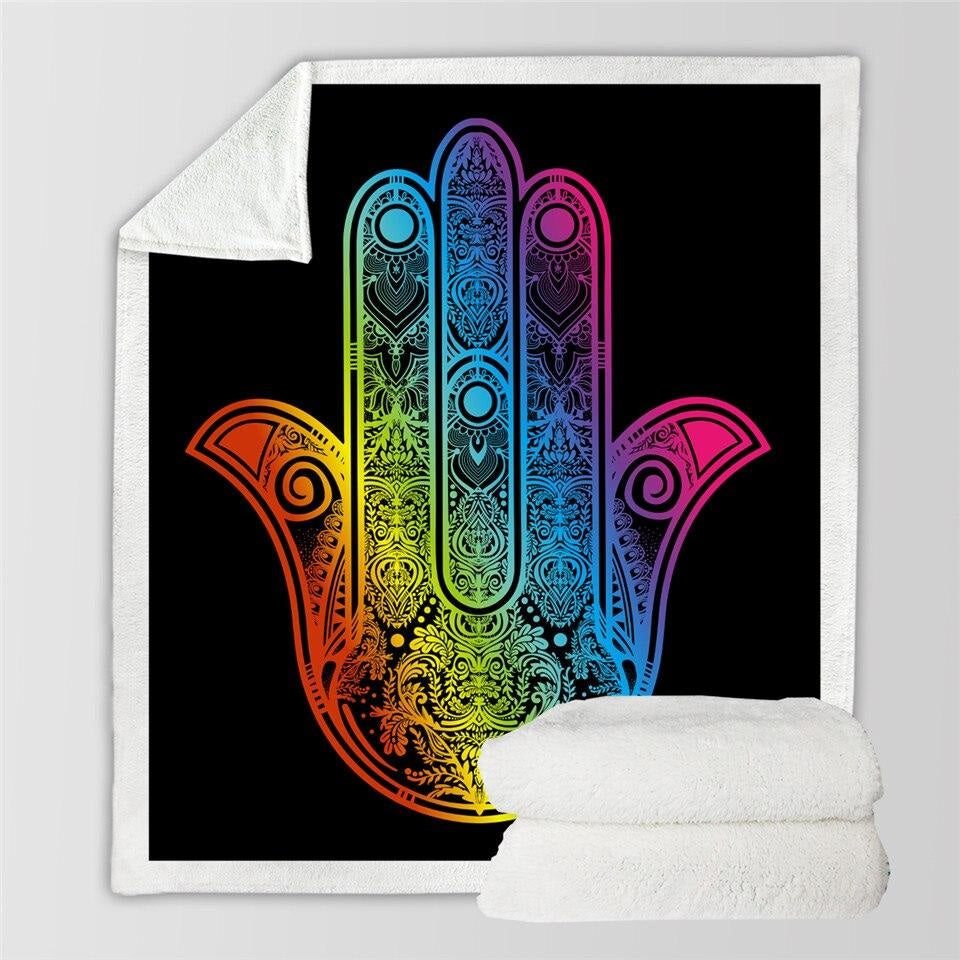 Rainbow hamsa blanket shown flat with a folded pale sherpa view beside it.