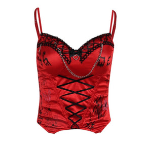 Closer isolated front view of the Heartbreaker bustier with its red graphic panels, black ribbon lacing and silver-tone chain.