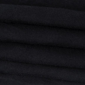 In Goth We Trust graphic T-shirt with a close view of the black fabric.