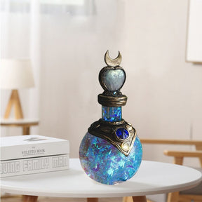 Blue crescent bottle on a table