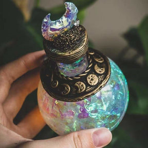 Iridescent crescent-top bottle angled view