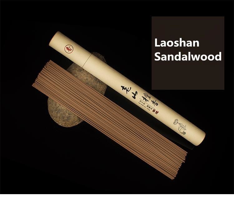 Laoshan sandalwood incense sticks laid beside their pale paper tube, with the fragrance name shown in the image.