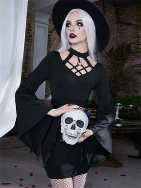 Black lattice-neck dress styled with belt and hat