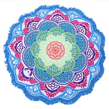Flat view of the blue-and-pink mandala flower throw, with repeating pale green petals around its red centre and white fringe beyond the blue edge.