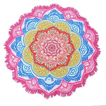 Flat view of the pink-and-blue mandala flower throw, with bright orange and yellow inner rings and white fringe beyond the pink border.