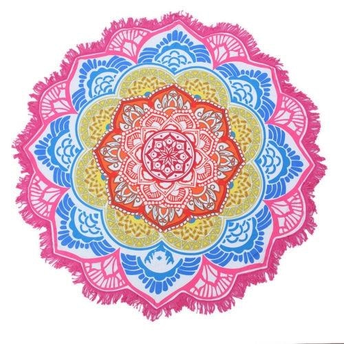 Pink-edged mandala flower throw with orange, yellow and blue petal rings radiating from the centre.