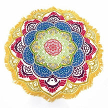 Flat yellow-and-red mandala flower throw with pale green inner petals, blue accents and white fringe around its yellow border.