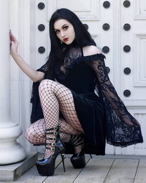 Black lace bell sleeve dress crouched outfit