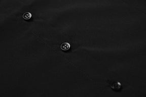 Close detail of black buttons and stitching along the Moon Child blouse’s front placket.