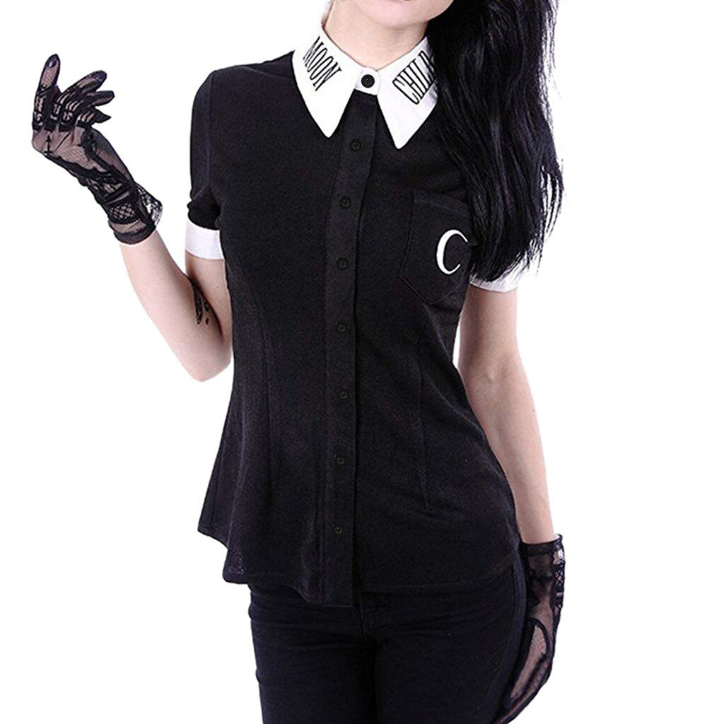 Front view of the black Moon Child blouse styled with separate lace gloves, highlighting the crescent chest pocket, white pointed collar and matching cuffs.