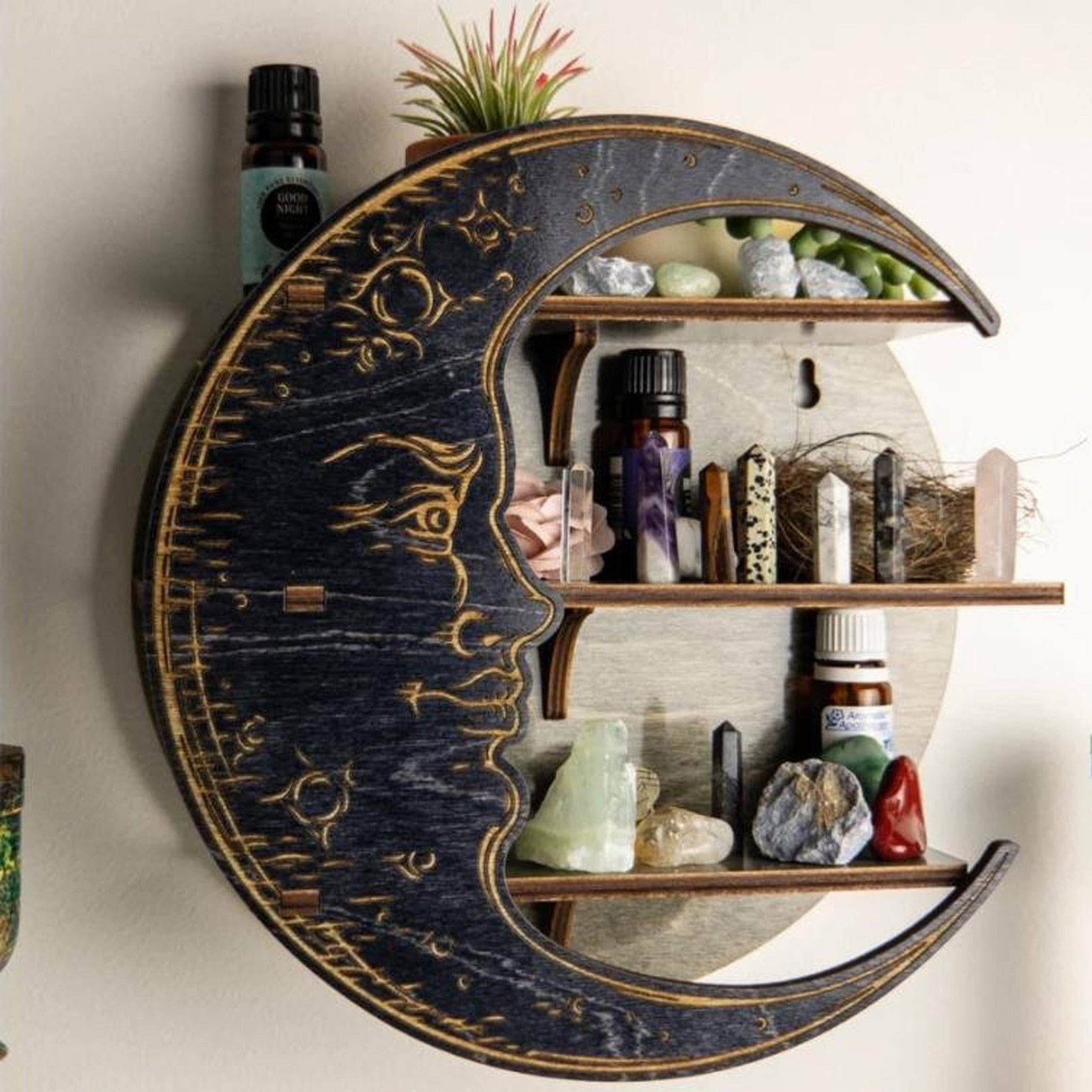 Black moon shelf styled on a wall