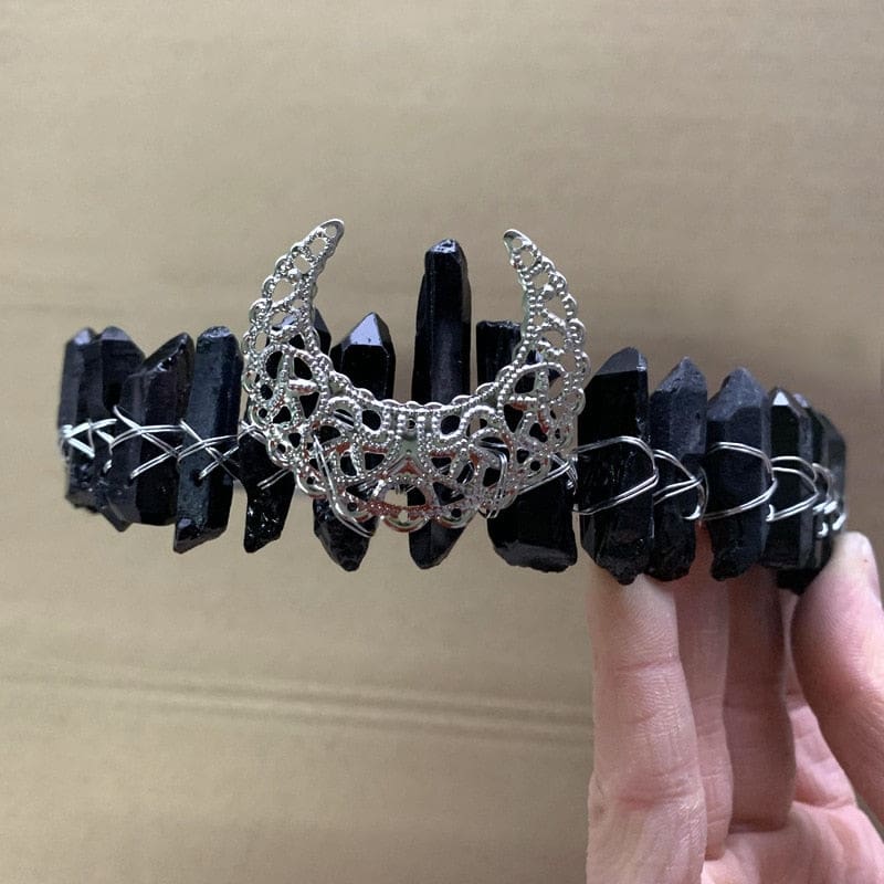 Black pointed-stone crown with a silver-tone crescent and bright wire wrapping.