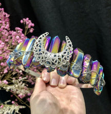 Rainbow aura point crown with an ornate silver-tone crescent and wrapped wire.