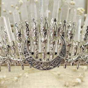 Close-up of scrollwork on the crescent centerpiece of a clear quartz crystal crown.