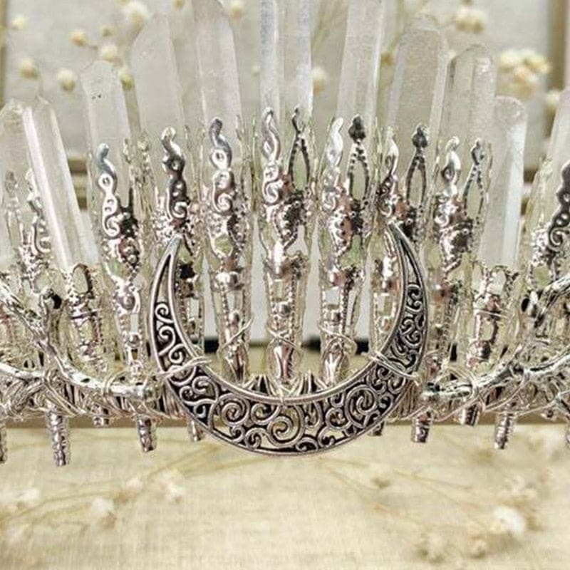 Close-up of scrollwork on the crescent centerpiece of a clear quartz crystal crown.