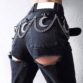 Rear view of the black crescent moon belt worn with distressed black jeans. Silver-tone chains curve between hanging moons across the waistband.