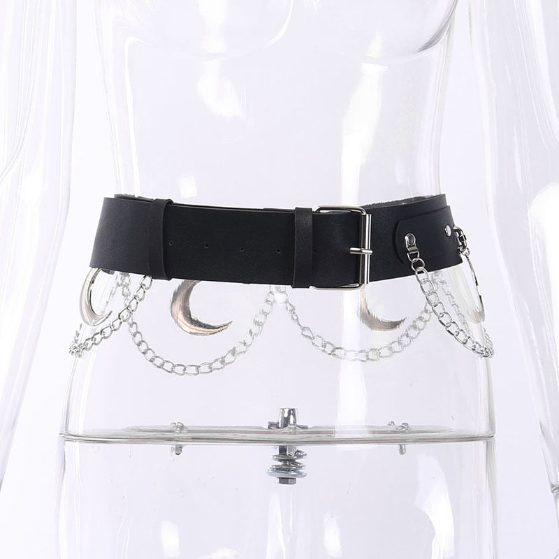 Front view of Mooncraft on a clear mannequin, showing the rectangular pin buckle and rows of silver-tone crescent moons and chains below the black strap.