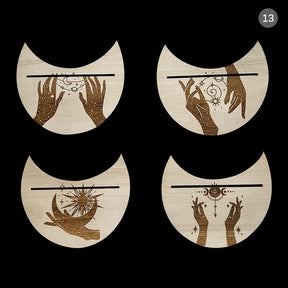 Four beige crescent tarot stands with symbolic hand designs, displayed as a set with their card slots facing upward.
