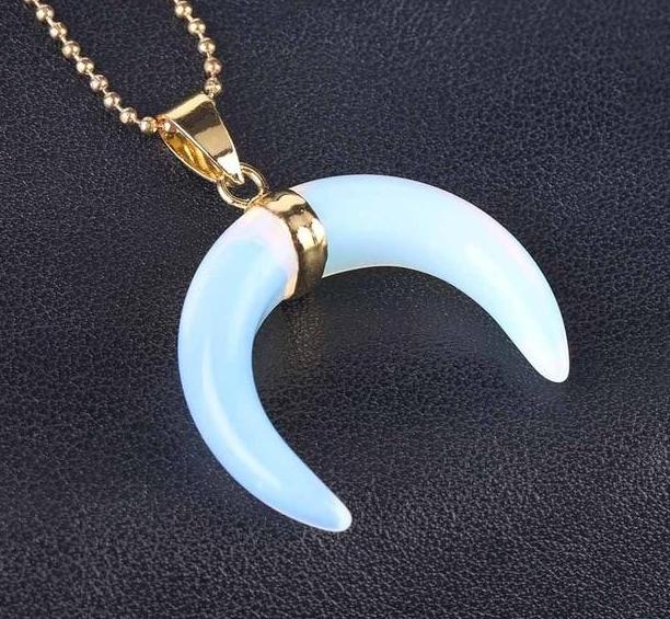 Milky pale-blue Opal option of the crescent moon pendant, hanging from a gold-tone centre band and chain.