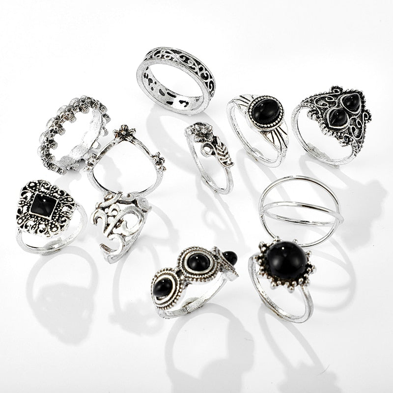 Eleven-piece silver-tone Namaste ring set with black accents with a closer view of the different bands and ornate settings.