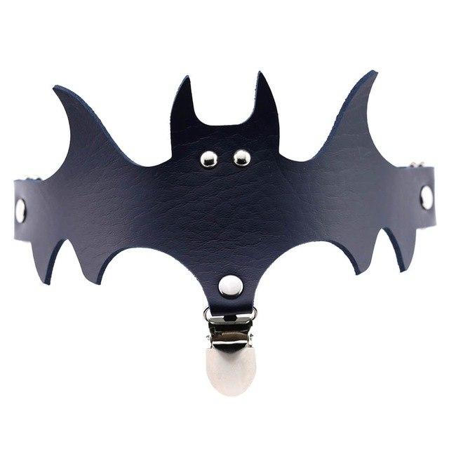 Navy blue bat garter showing its wide wing silhouette and central stocking attachment.