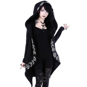 Black open-front hooded cardigan with white occult-style symbols tracing the hood and draped front edges. It is worn over separate black clothing, with the long pointed hem falling beside the legs.