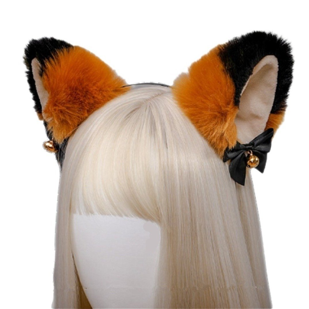 Fuzzy orange and black cat ear headband with pale inner ears, black ribbon bows, and gold-tone bells