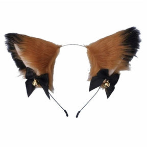 Fuzzy orange and black cat ear headband with pale inner ears, black ribbon bows, and gold-tone bells