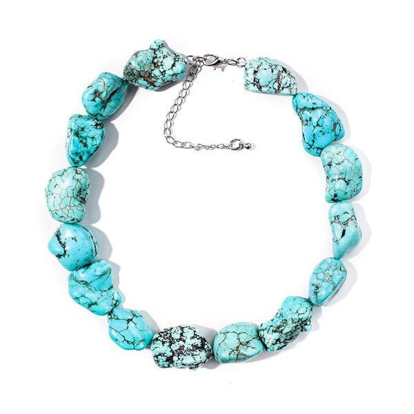 Turquoise-coloured choker made from irregular oval stones with dark markings and silver-tone hardware.