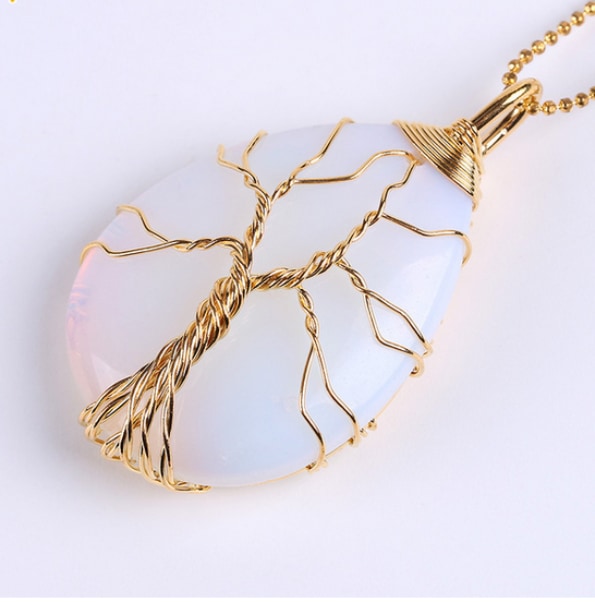 Pale Opal option pendant on a gold-tone chain, with branching gold-tone wirework over the light-coloured stone.