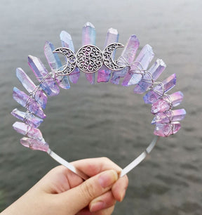 Silver-tone triple moon emblem framed by pastel rainbow crystal points, shown in a full front view of the crown.