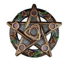 Gold-tone star-shaped holder with a central triquetra, five round candle platforms and sculpted roses with green leaf accents.