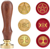 Pentagram, triple moon and Tree of Life stamp heads arranged with a single wooden handle and matching red wax impressions.