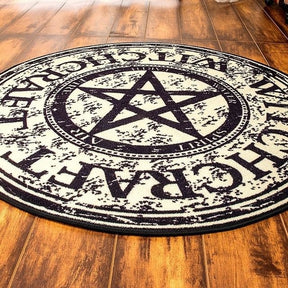 Low angled view of the round pentagram rug, showing its printed surface and bound outer edge.